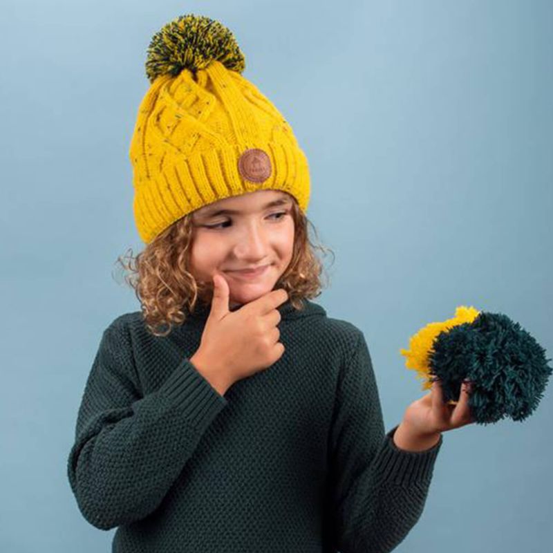 Bonnet enfant 6-12 ans Cabaïa avec 3 pompons interchangeables Jus de pomme  Yellow - Jaune moucheté vert foncé